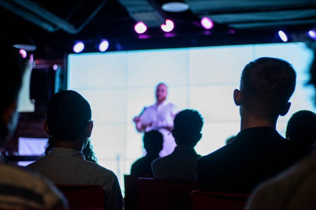 confident speaker on stage
