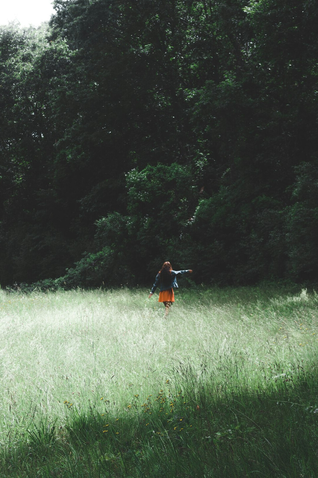 person walking in nature thinking